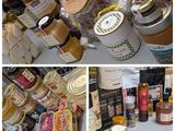 many different types of jams and condiments on the table