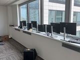 a room with a lot of computers on the windows