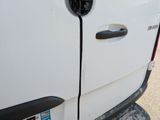 a close up of a car door handle with a sticker on it