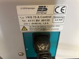 an image of a close up of a power strip connected to a machine