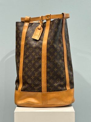 a louis vuitton bag on display in a museum