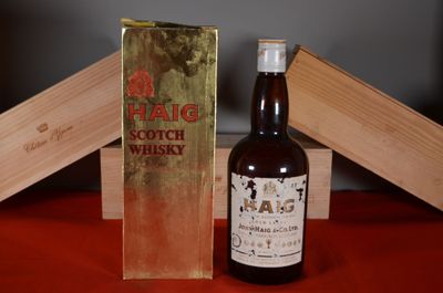 a bottle of alcohol sitting next to a box of wine