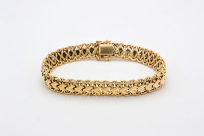 an 18k yellow gold bracelet with a braid design