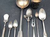 a lot of silver spoons and spoon spoons on a table