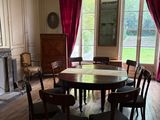 a dining room with a table and chairs in it