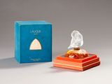 an image of a perfume bottle in a box next to a box of perfume