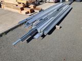 several pieces of metal are stacked on top of each other in a parking lot