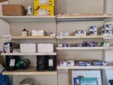 a shelf with many items on it in a room