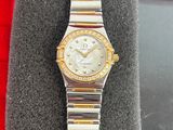 a close up of a watch on display in a box