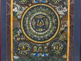 a painting of a circular design on a brown background