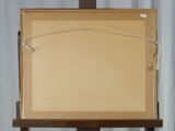 a picture of a painting on a easel with a white curtain in the background