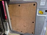 a picture of a car door with a wooden panel