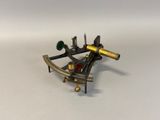an old brass sexet on a white surface with a white background