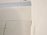 a close up of a toilet with a toilet paper dispenser on it