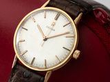 an image of a close up of a wrist watch on a red case