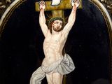 an image of a painting of a man on a cross on a plaque