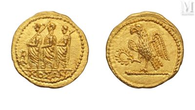 a gold coin with an image of a woman and a bird on it