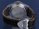 a close up of a watch on a blue surface