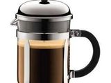 a glass french press coffee maker with a black handle