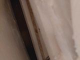 a close up of a piece of paper with a knife sticking out of it
