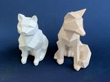 two paper sculptures of a cat and a dog on a blue background