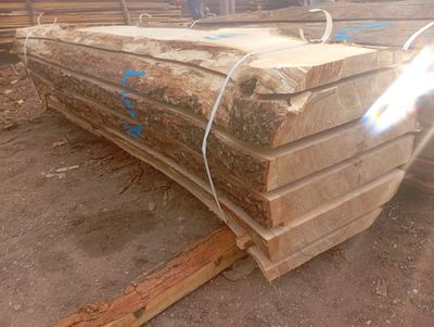 several pieces of wood are stacked on top of each other in a pile