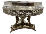 an antique silver plate with a stand on a white background