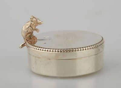a small silver box with a mouse on it