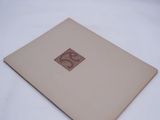 an open book sitting on top of a white table