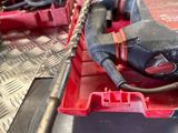 a picture of a tool box with a drill and other tools