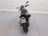a motorcycle parked in a room with a number plate on the back of it