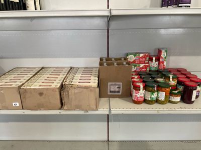 many boxes of food on the shelves in the store