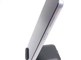 a close up of a cell phone on a stand