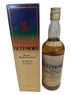 an image of a bottle of whisky next to a box