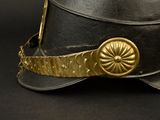 a black hat with a gold buckle on it