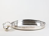 a silver tray with a handle and a teapot on it
