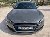 the front view of a black audi car parked in a parking lot