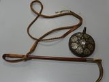 a cane and a hat on a white table