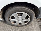 a white car that has a flat tire on it