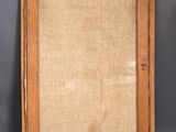 an old wooden frame with a burlock cloth backing