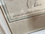 a picture of a map on the window sill of a house