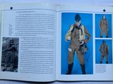 an open book with a picture of a woman in uniform