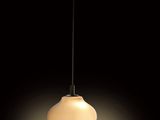 a close up of a light fixture on a black background