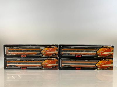 three boxes of hotdogs sitting on top of a table