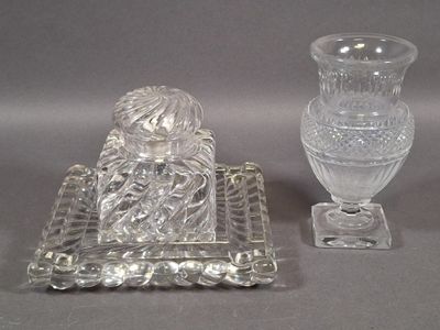 two glass vases sitting next to each other on a table