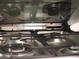 a close up view of a stove top with a glass cover