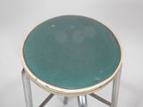 an image of a green stool with a metal base