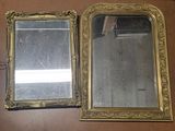 two mirrors that are sitting next to each other on a table
