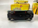 two toy cars sitting next to each other on a table