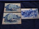 quatre peintures sur carreaux bleus et blancs représentant des bateaux, montées sur une toile bleue